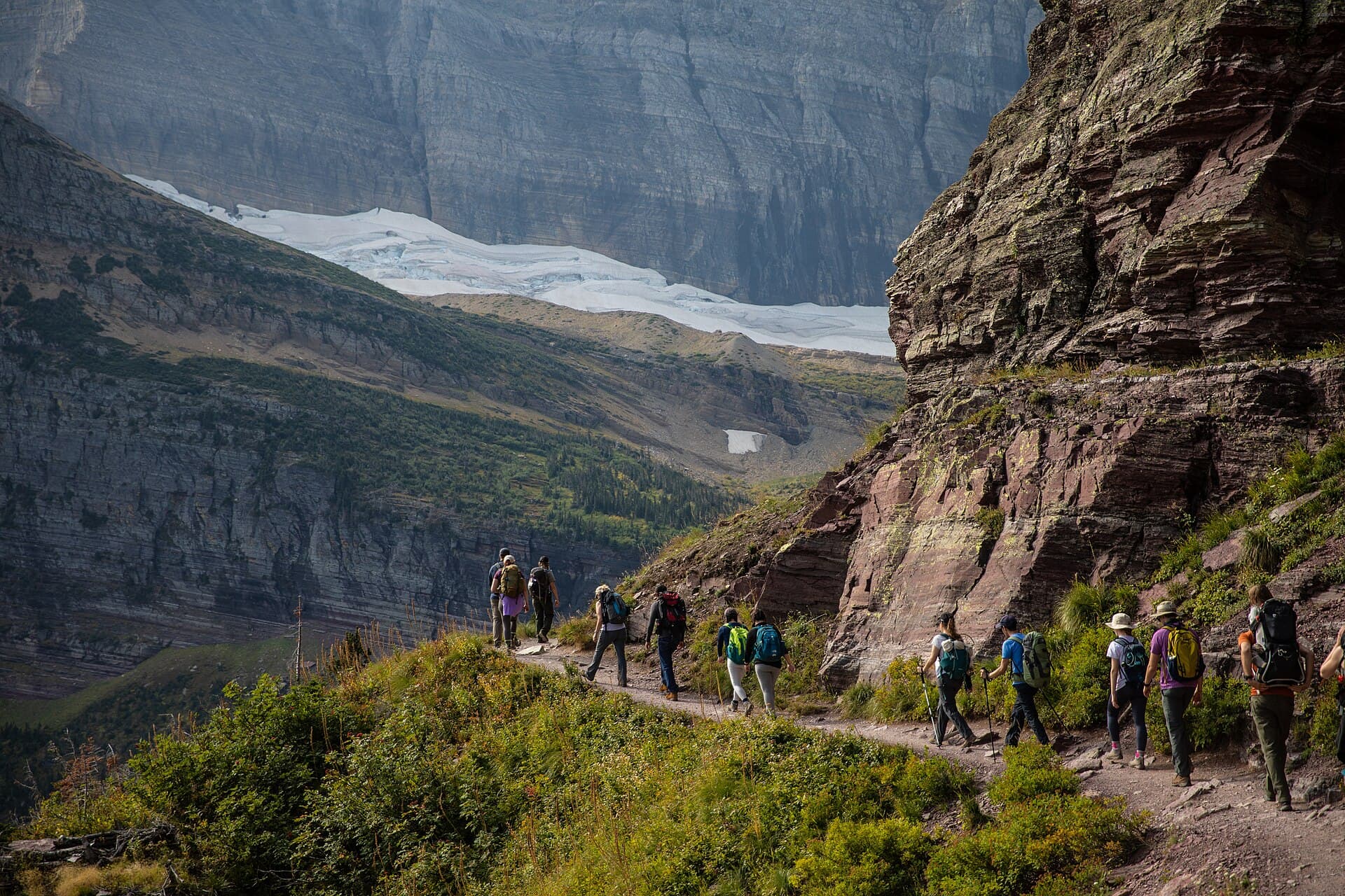 A group of hikers traveling together on a mountain trail