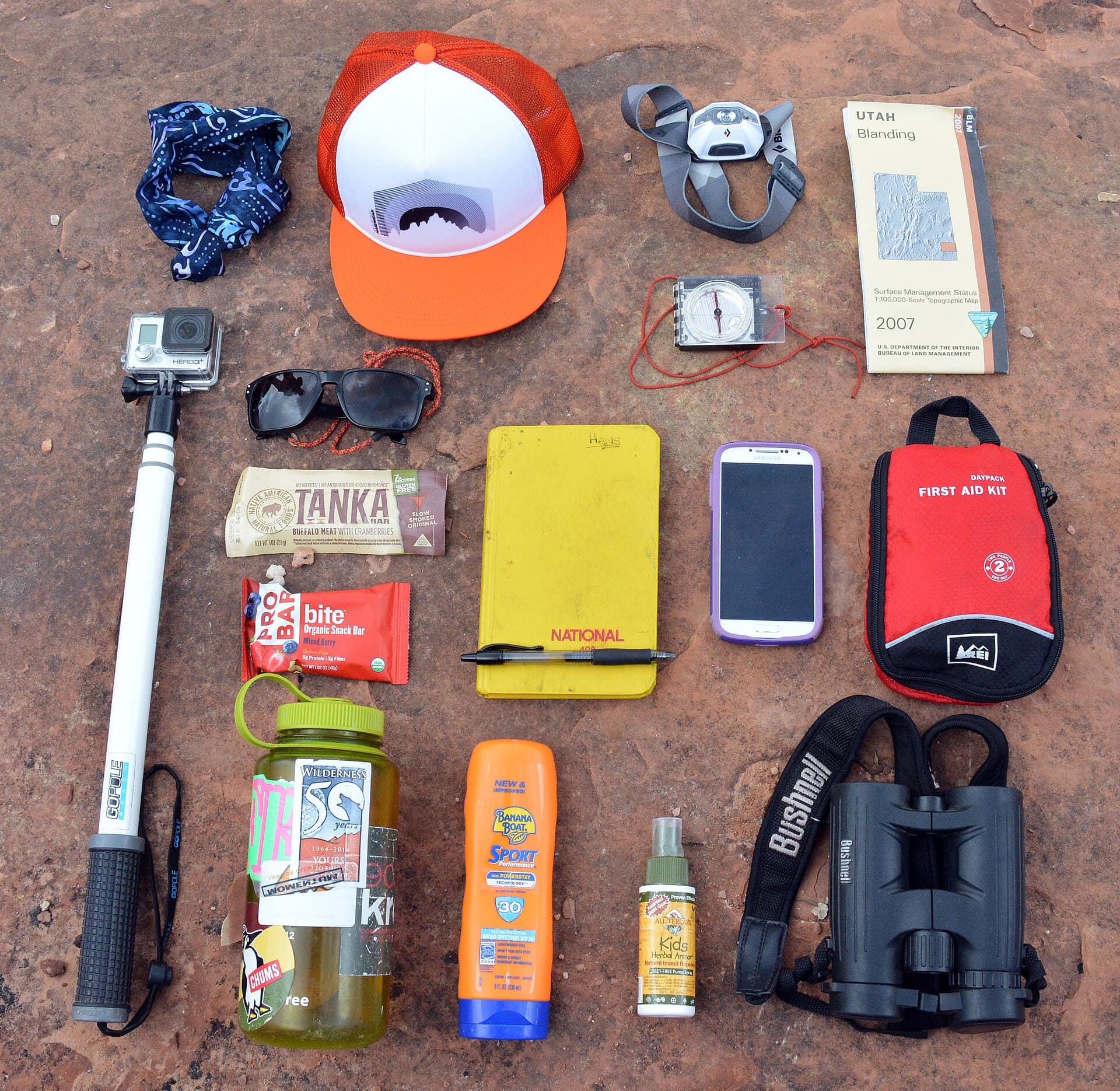 Day-hiking essentials including water, food, first aid, map, compass, and sunscreen