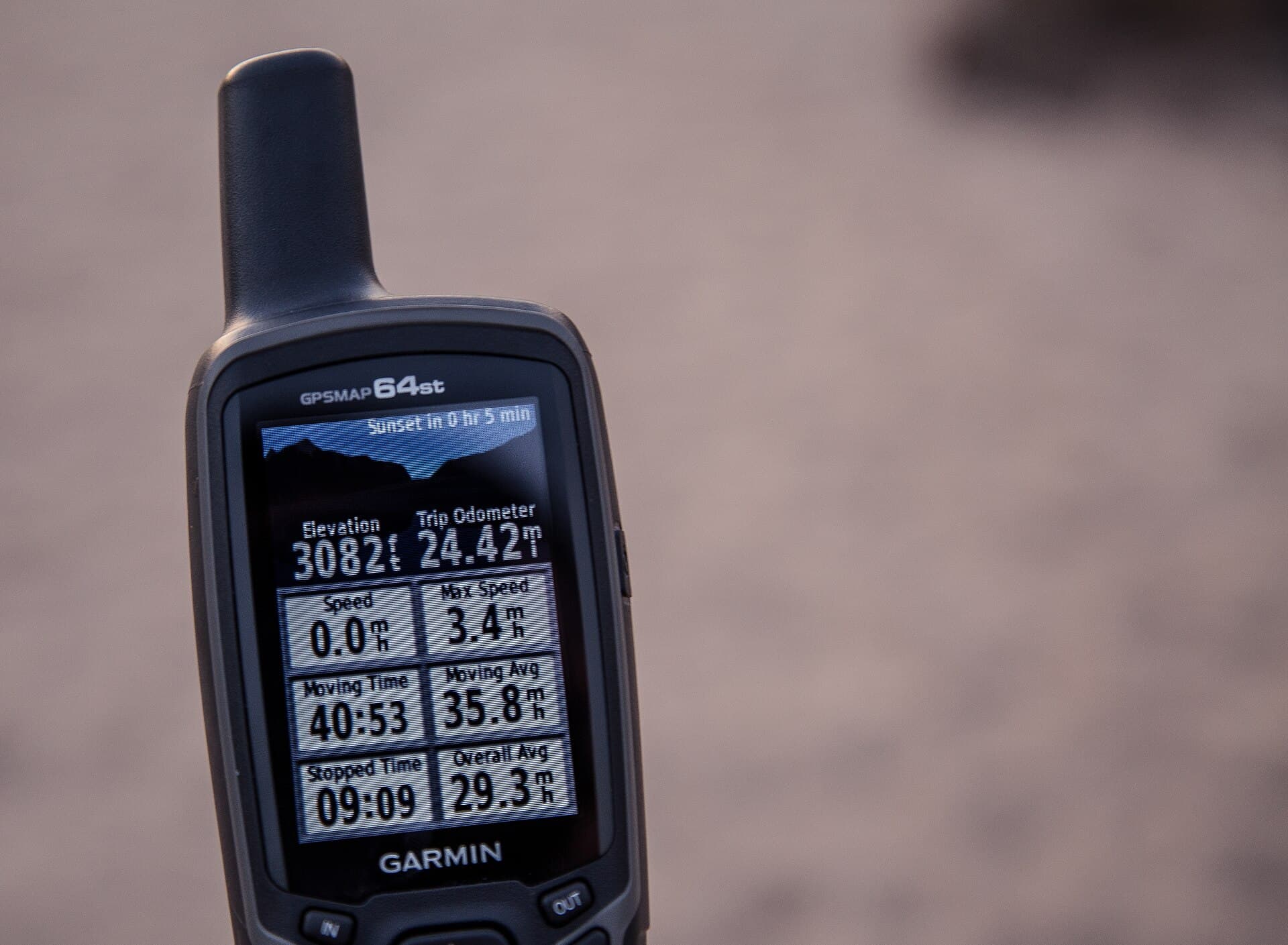 A handheld hiking GPS displaying an outdoor navigation map